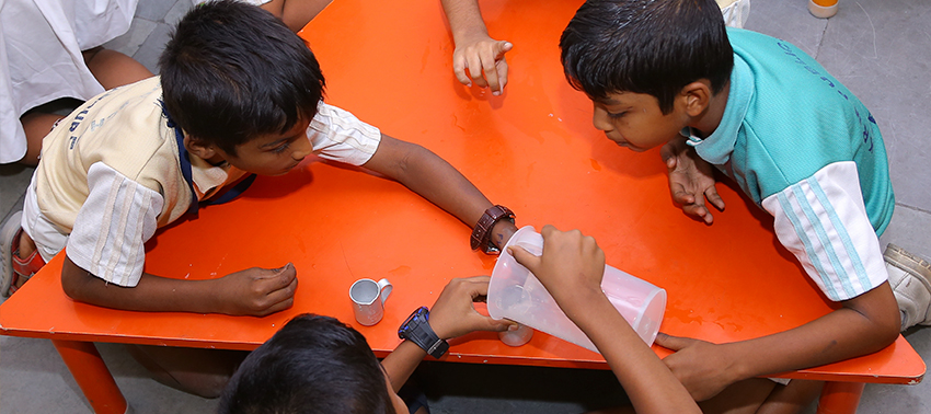 Primary students working with maths lab materials